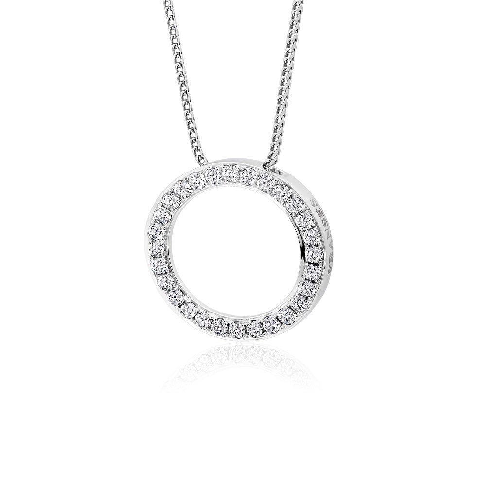 Silver necklace with a round pendant on a white background