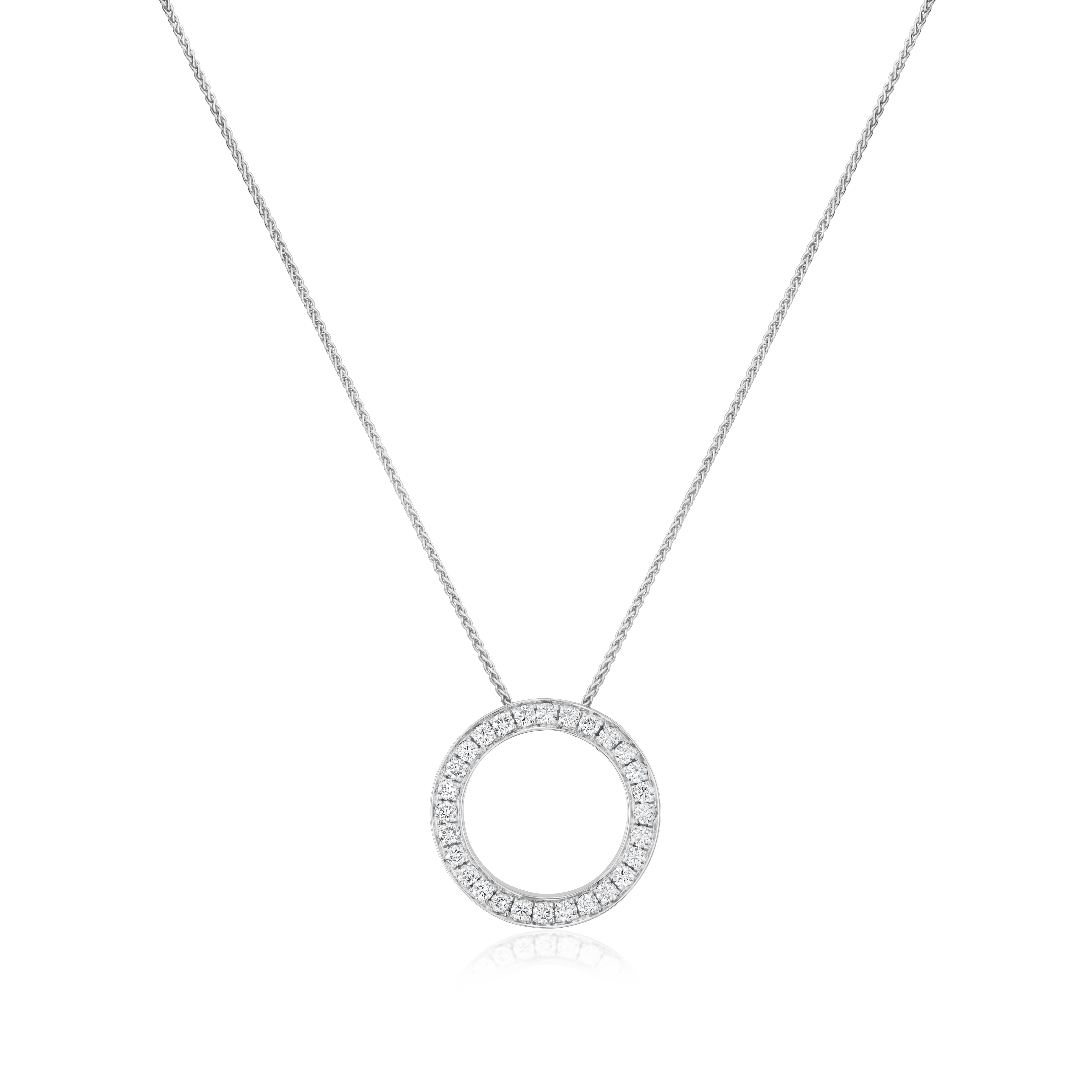 Silver necklace with a round pendant on a white background
