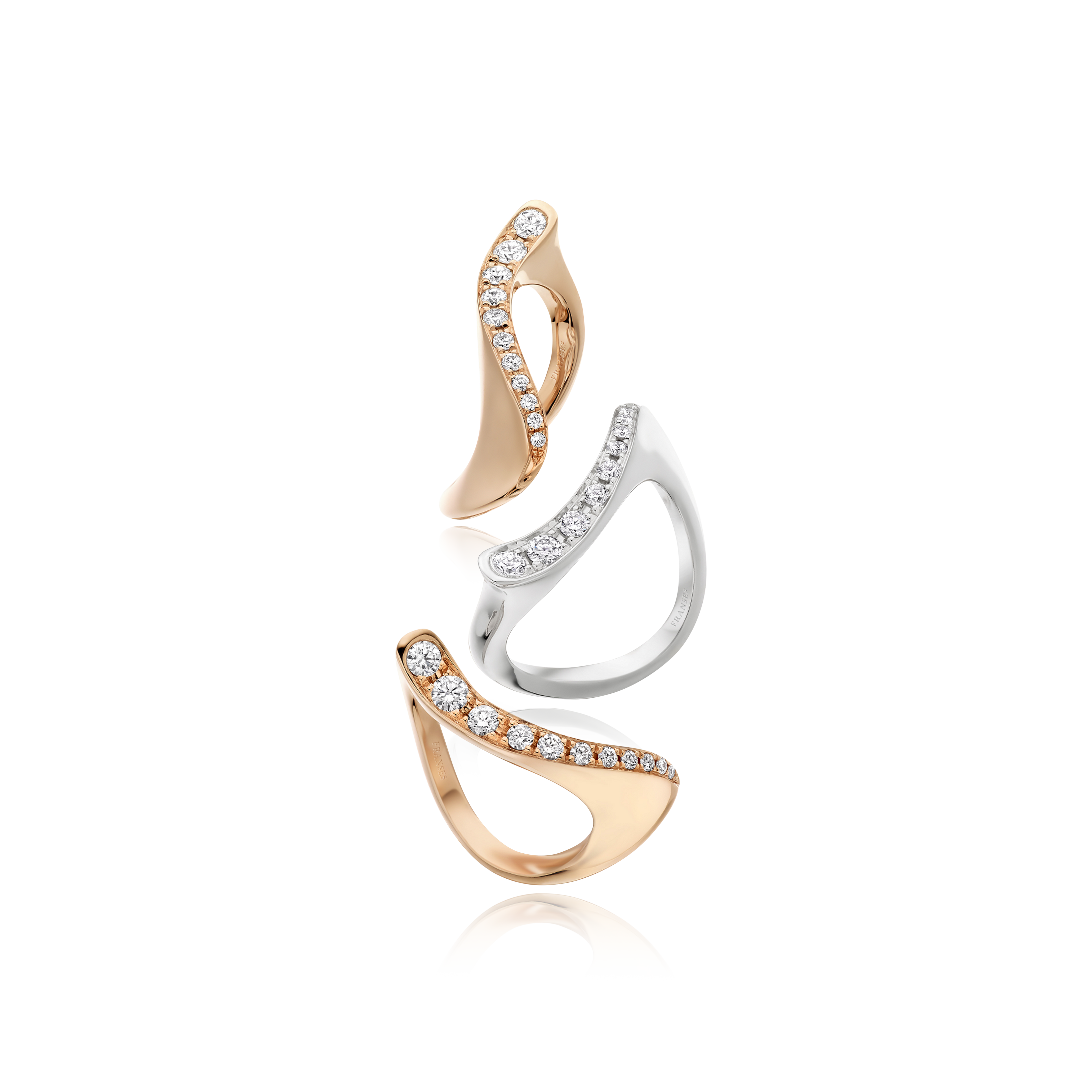 Pair of gold and silver earrings on a white background