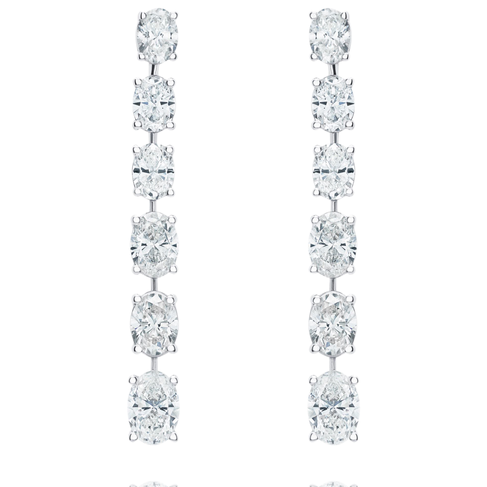 Pair of diamond earrings on a white background