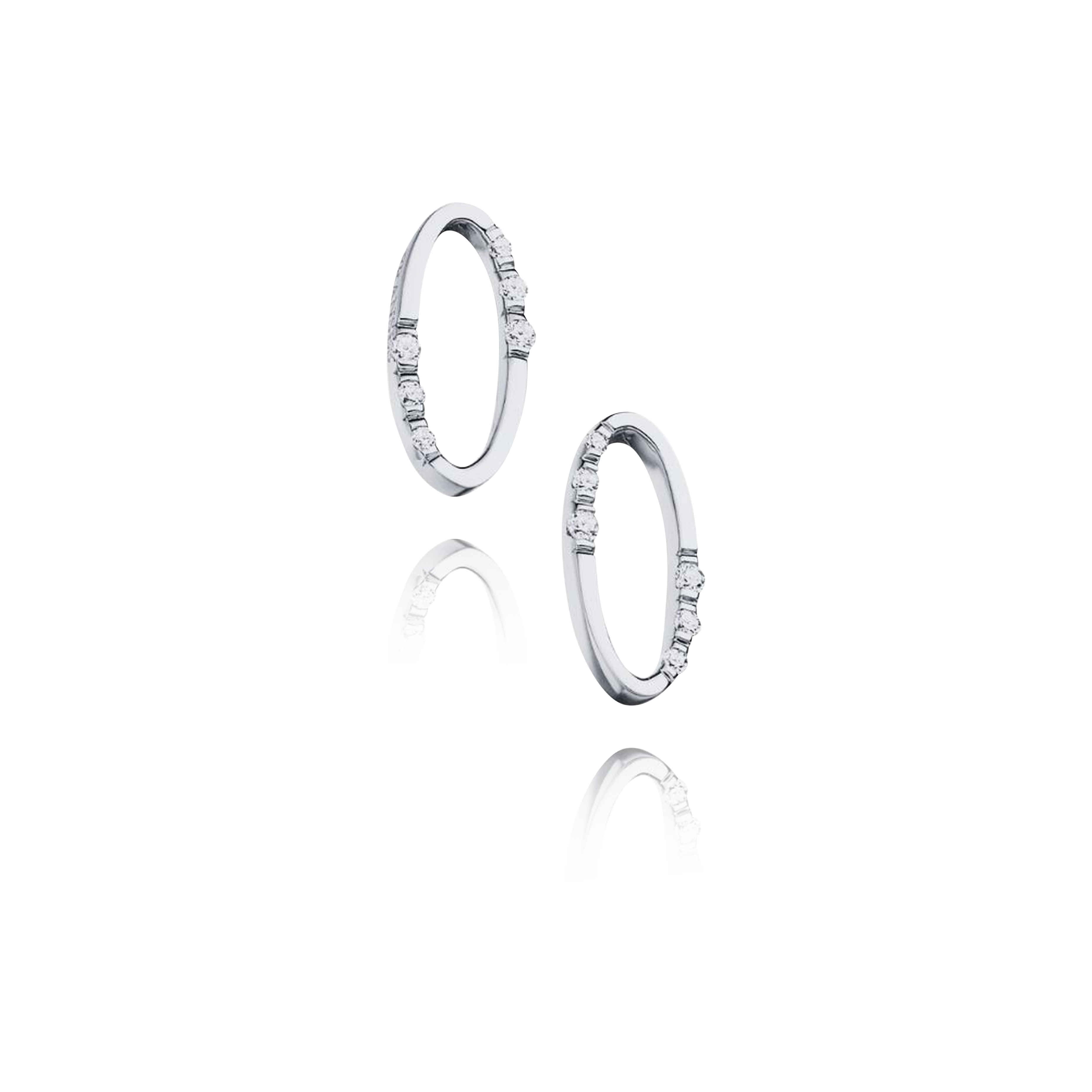 Set of silver hoop earrings on a white background