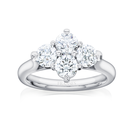Diamond ring with three clear gemstones on a white background