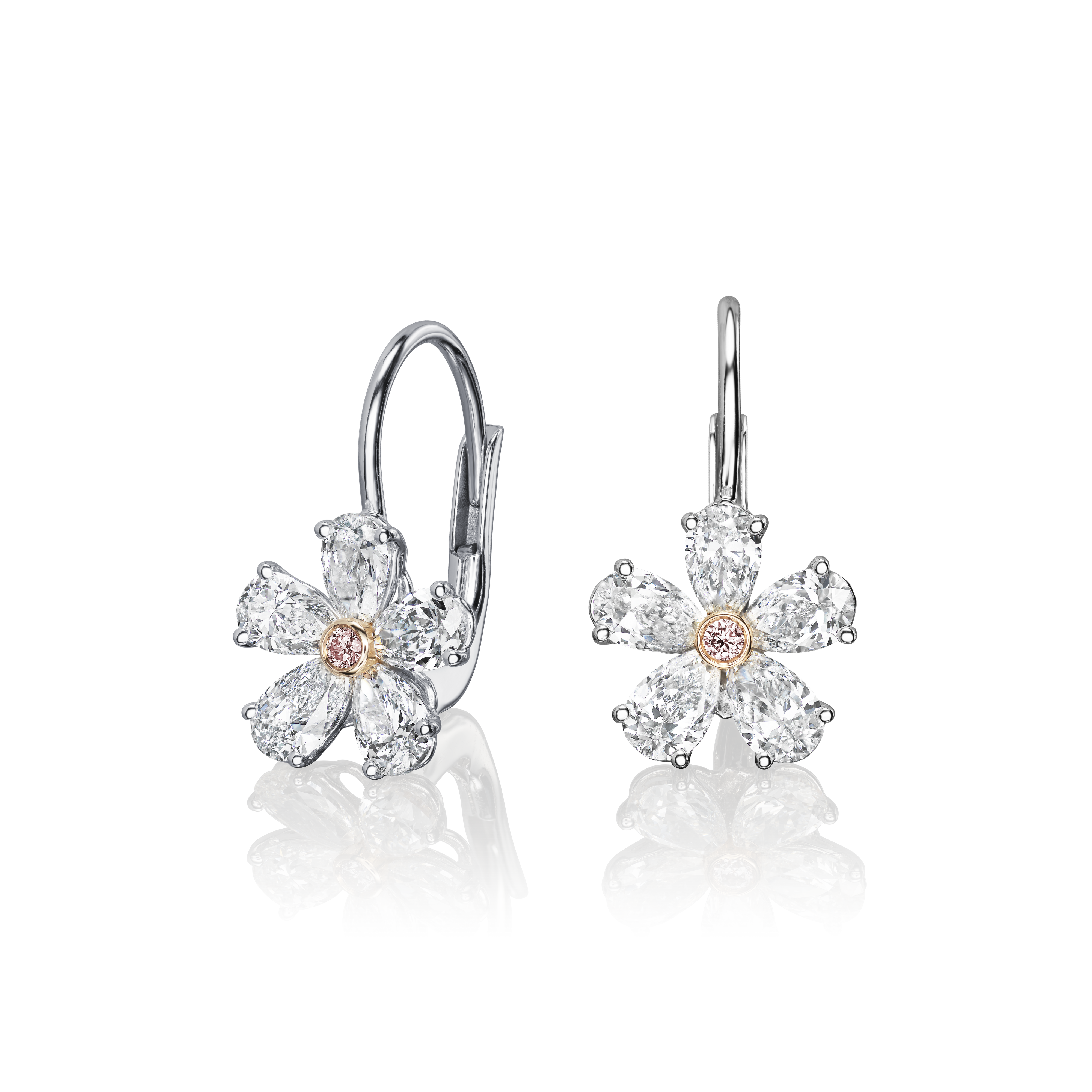 Flower-shaped earrings with clear stones on a white background