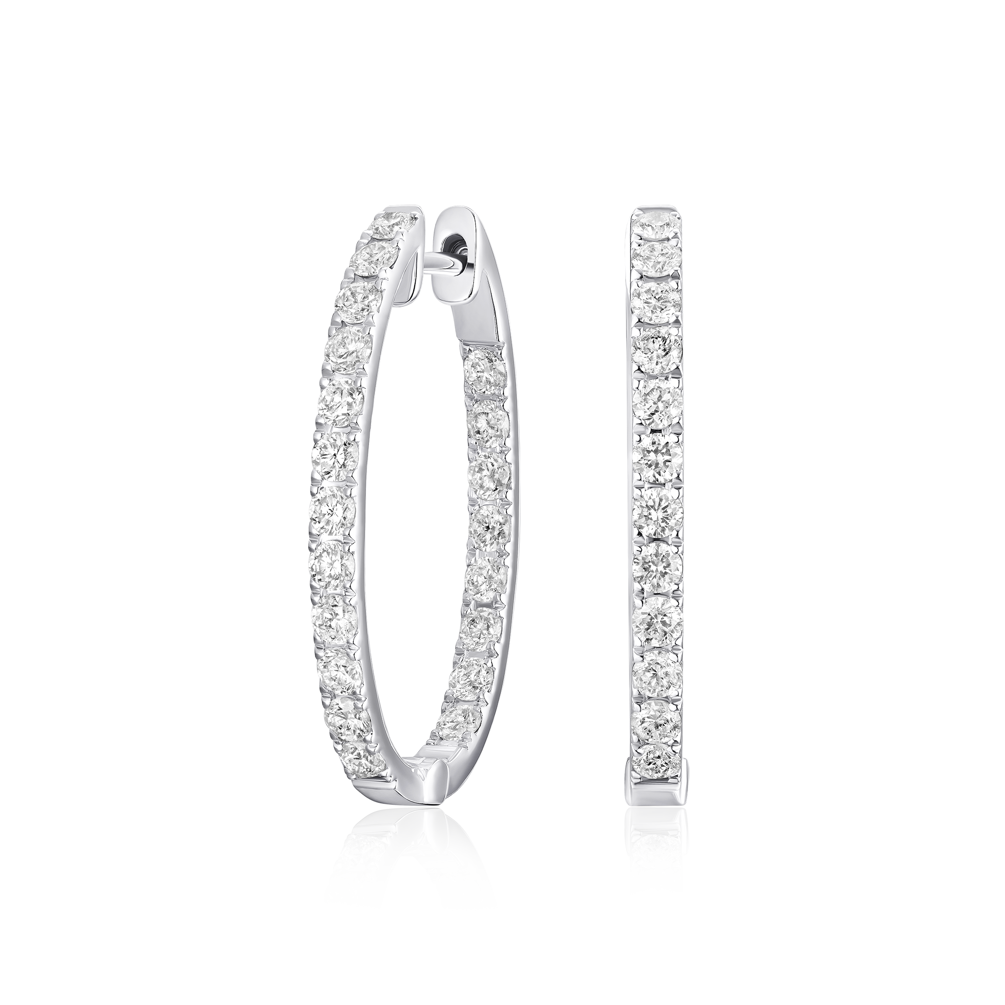 Pair of silver hoop earrings with clear gemstones on a white background