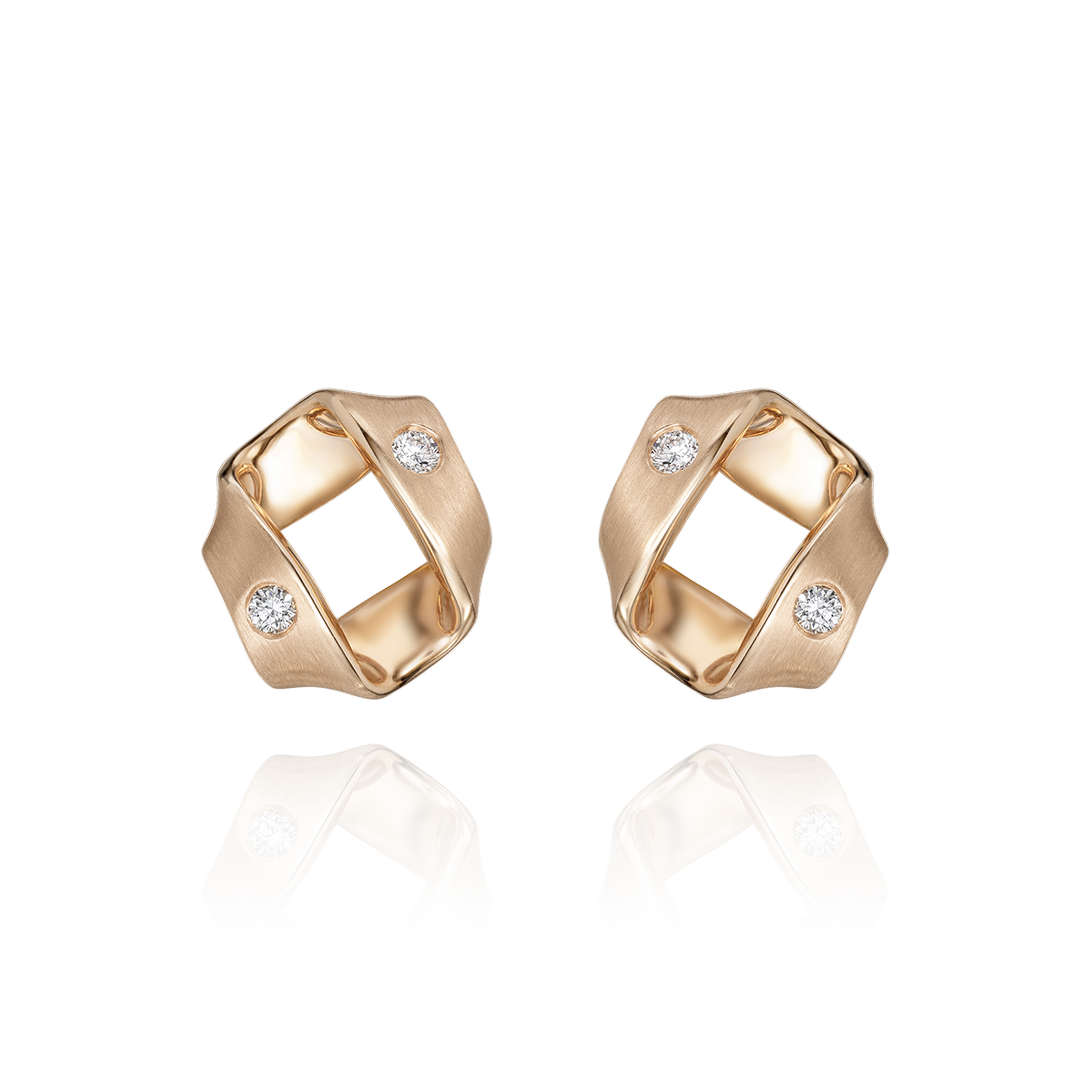 Gold earrings with diamond accents on a white background