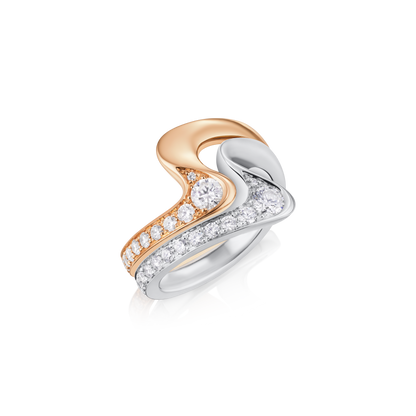 Two-tone heart-shaped ring with diamonds on a white background