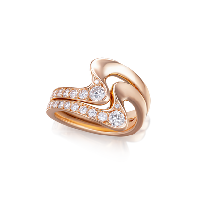 Rose gold ring with diamond accents on a white background