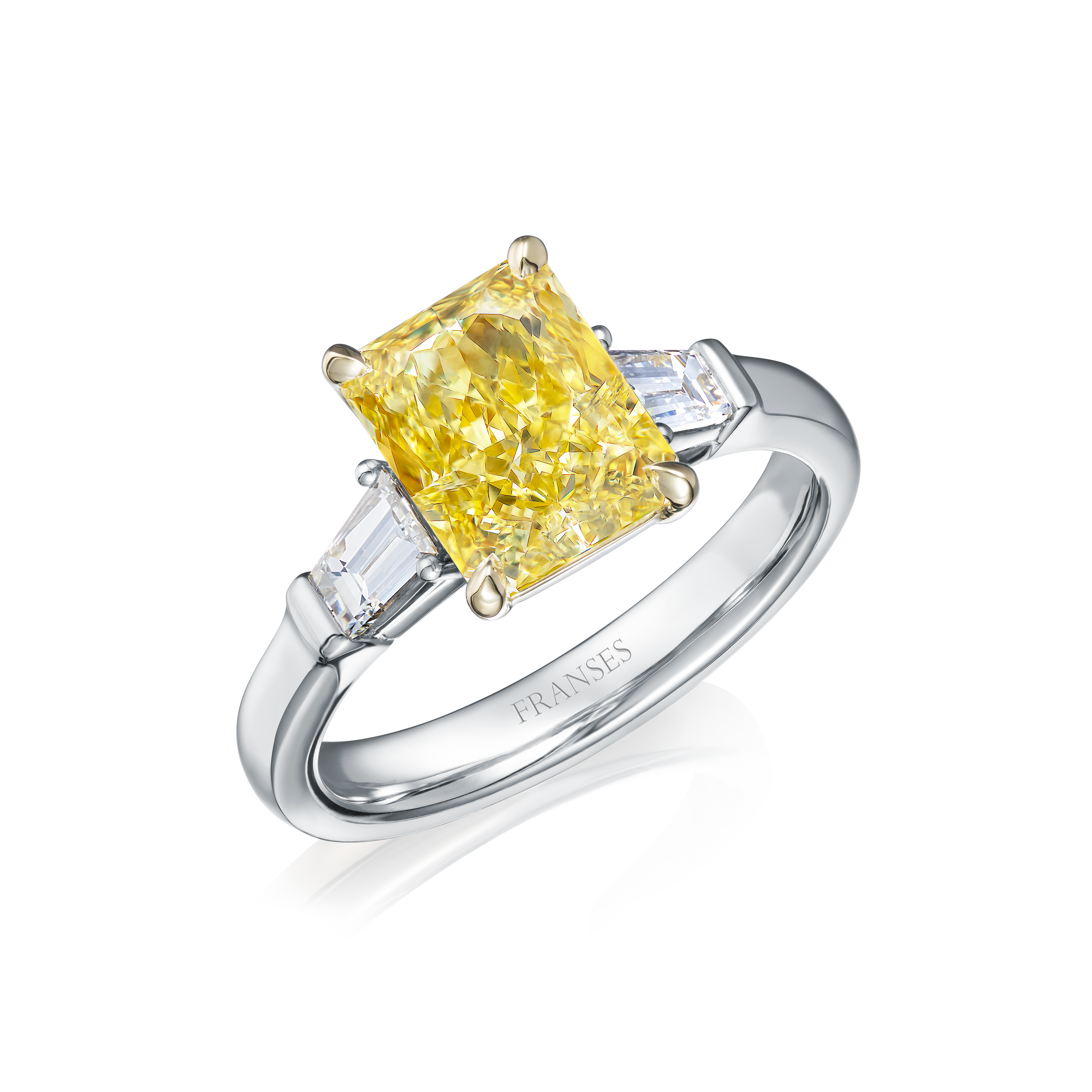 Diamond ring with a yellow diamond and two smaller diamonds on a white background