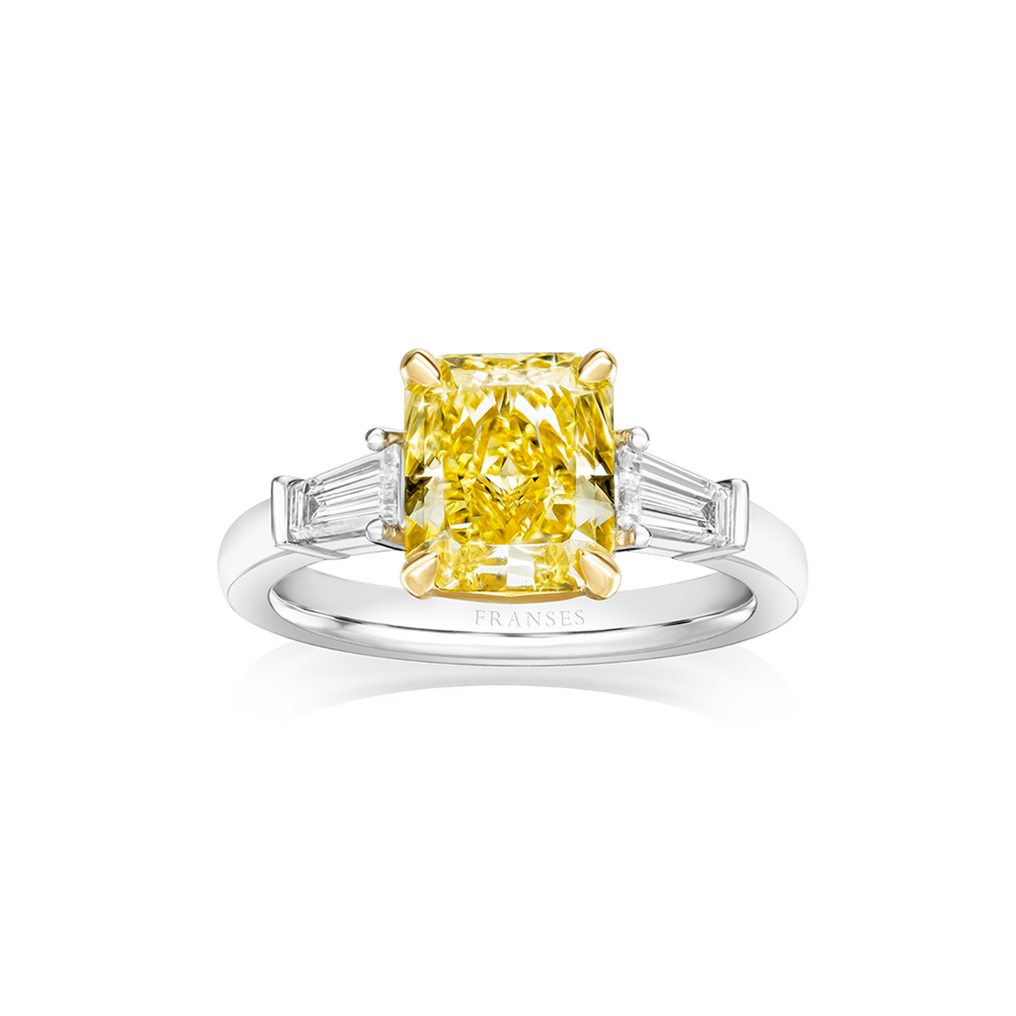 Ring with a yellow diamond and two baguette diamonds on a white background