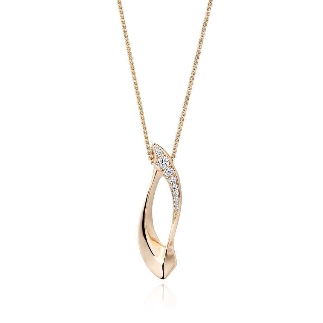 Gold necklace with a pendant on a white background