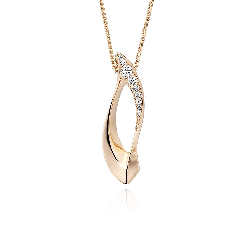 Gold necklace with a wave-shaped pendant on a white background