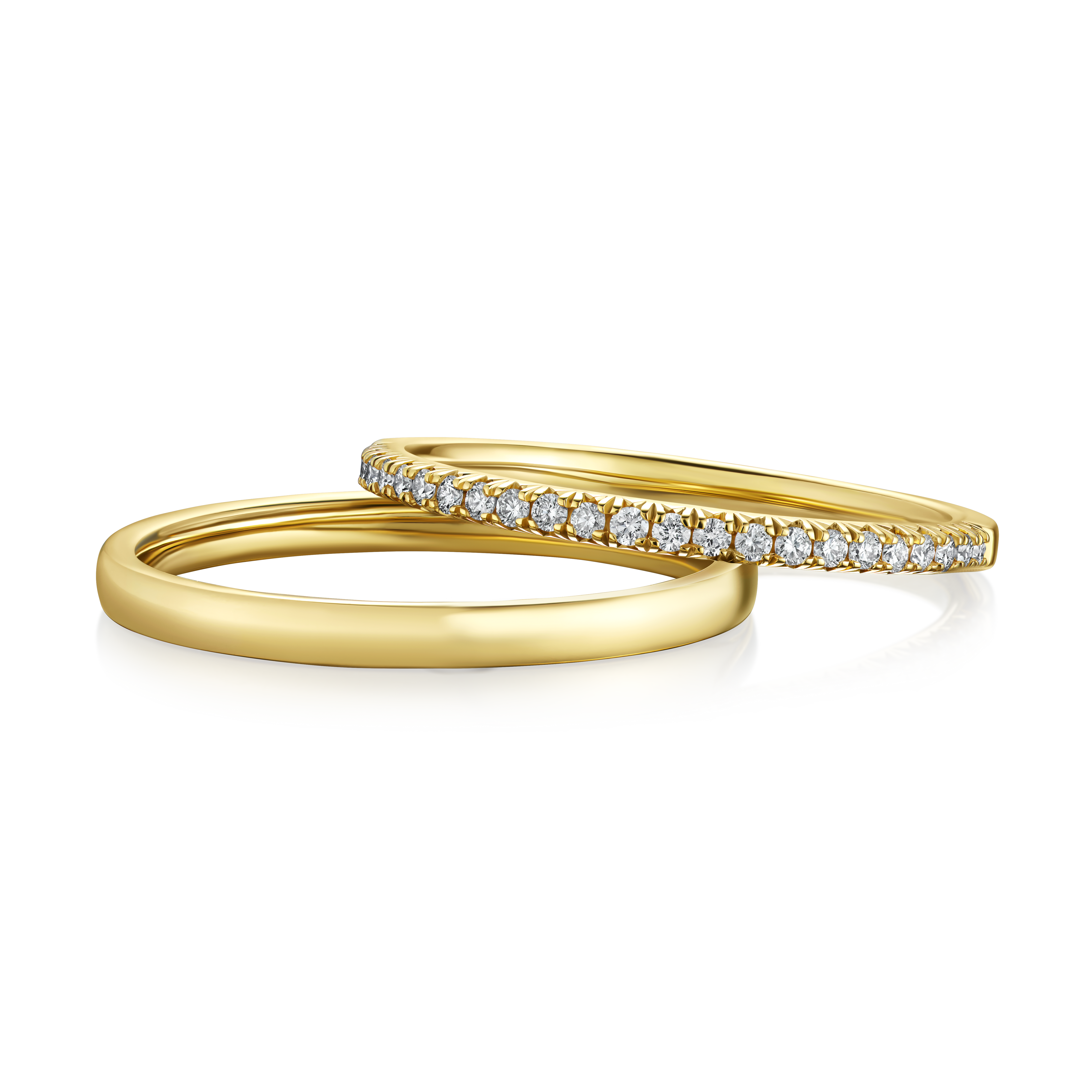 Two gold rings with diamond accents on a white background