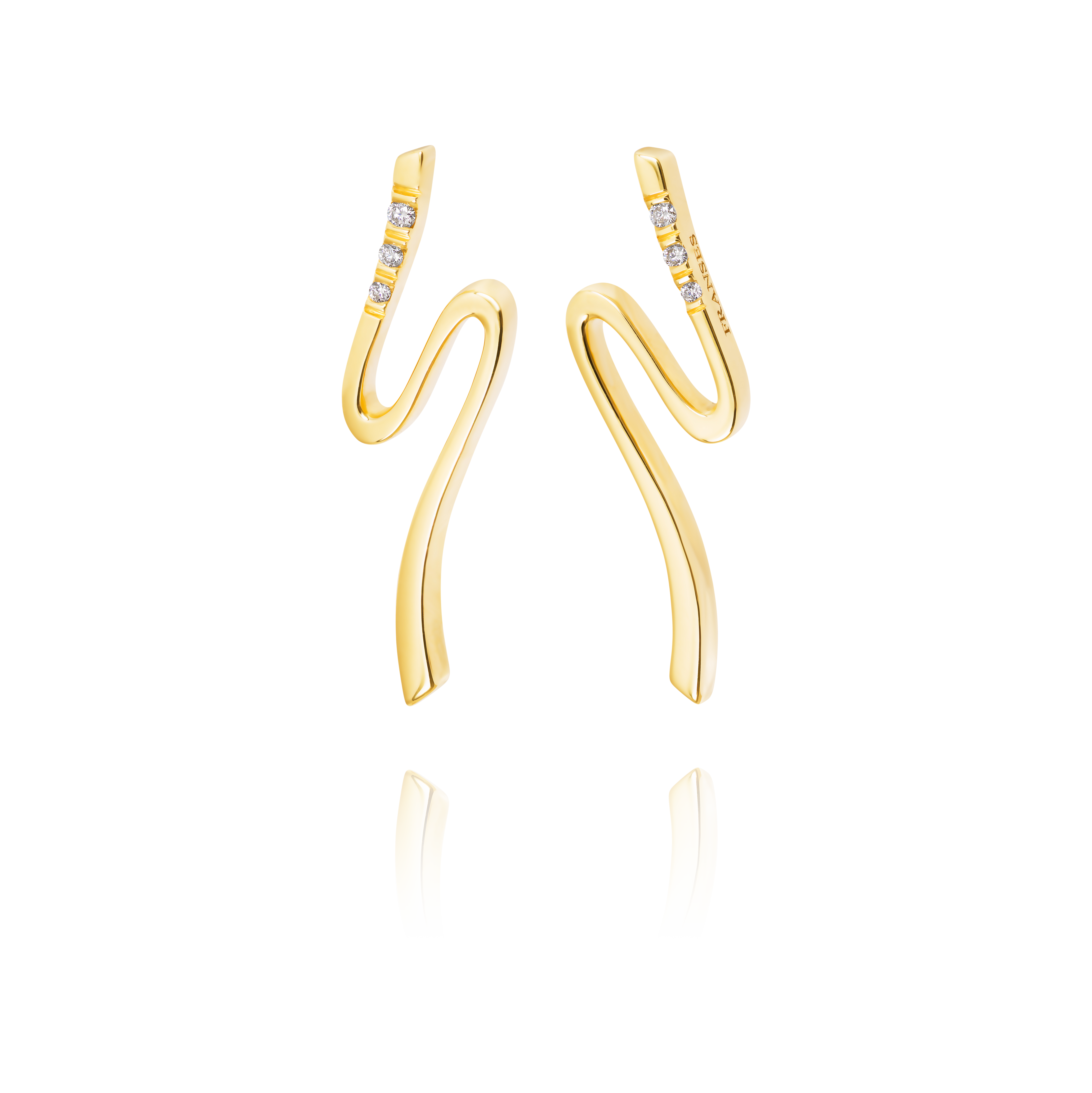 Gold earrings with a wavy design on a white background