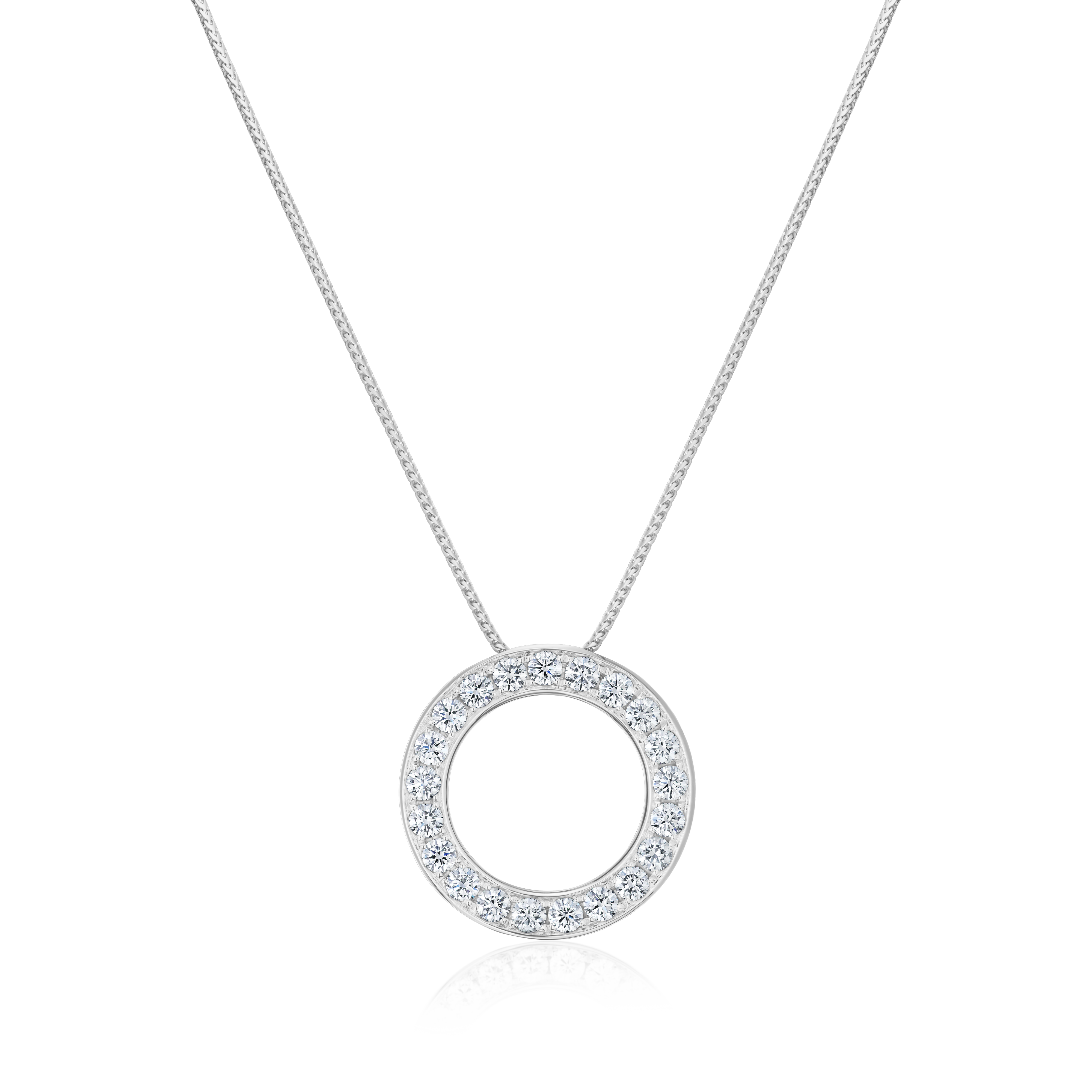 Silver necklace with a round pendant on a white background