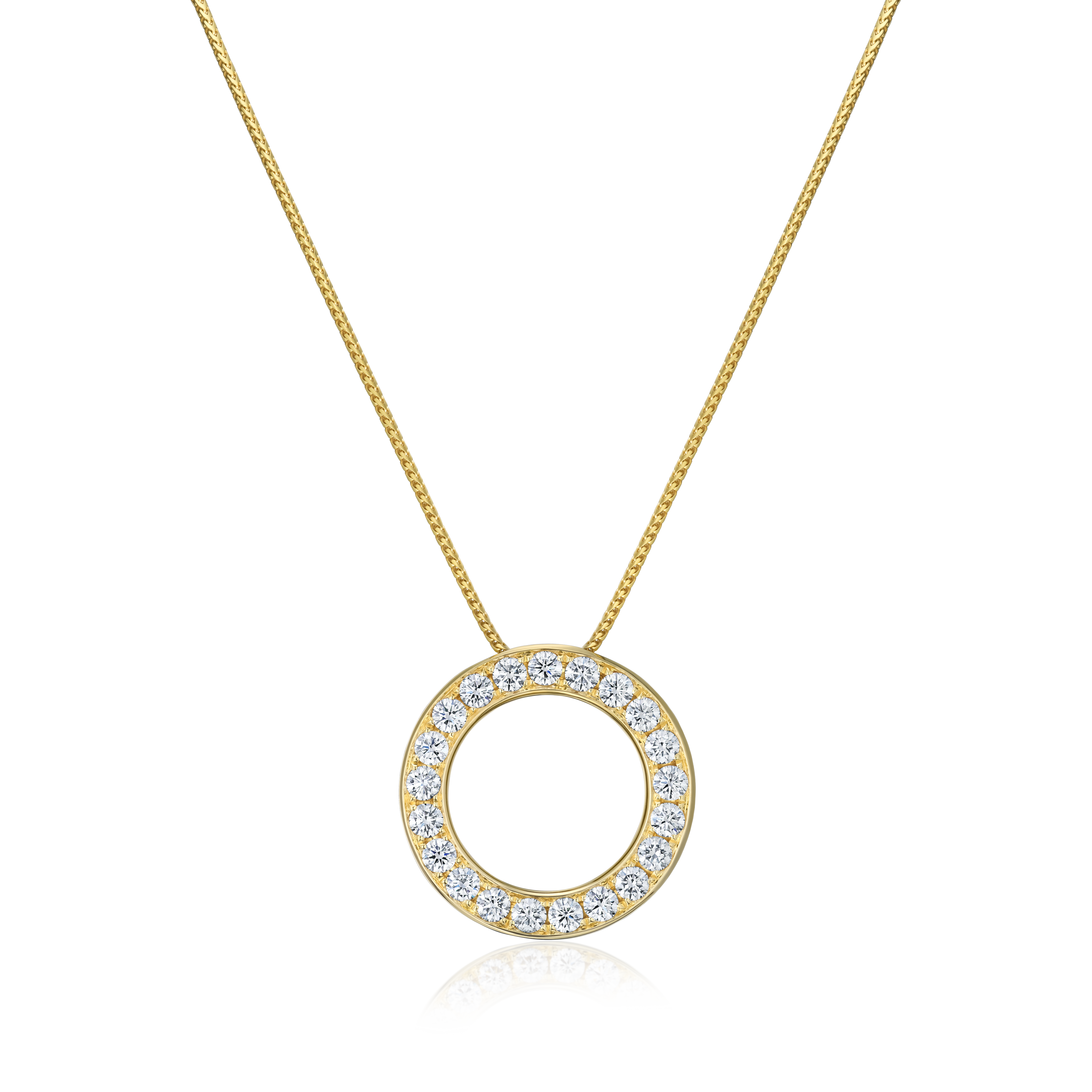 Gold necklace with a circular pendant on a white background