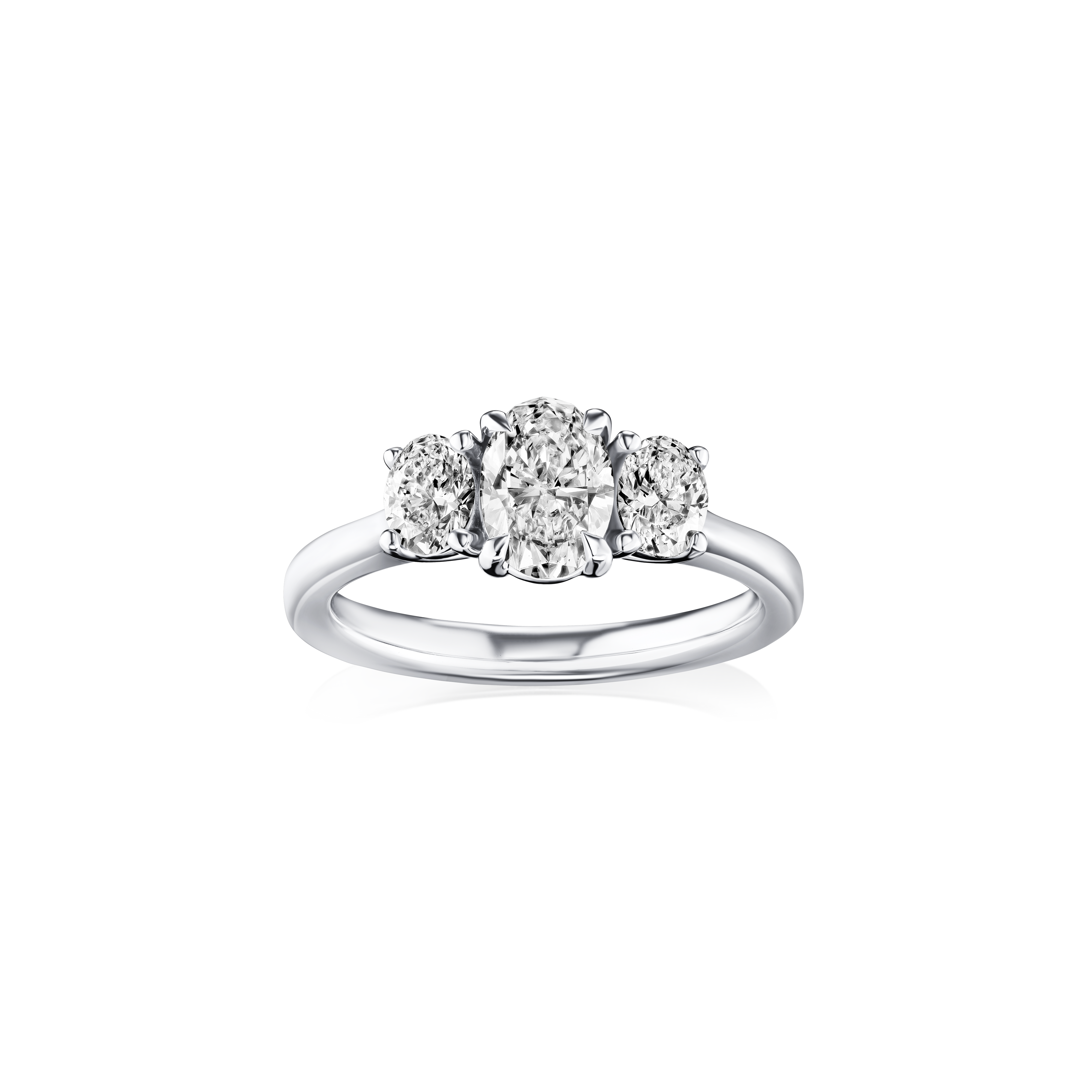 Diamond ring with three stones on a white background