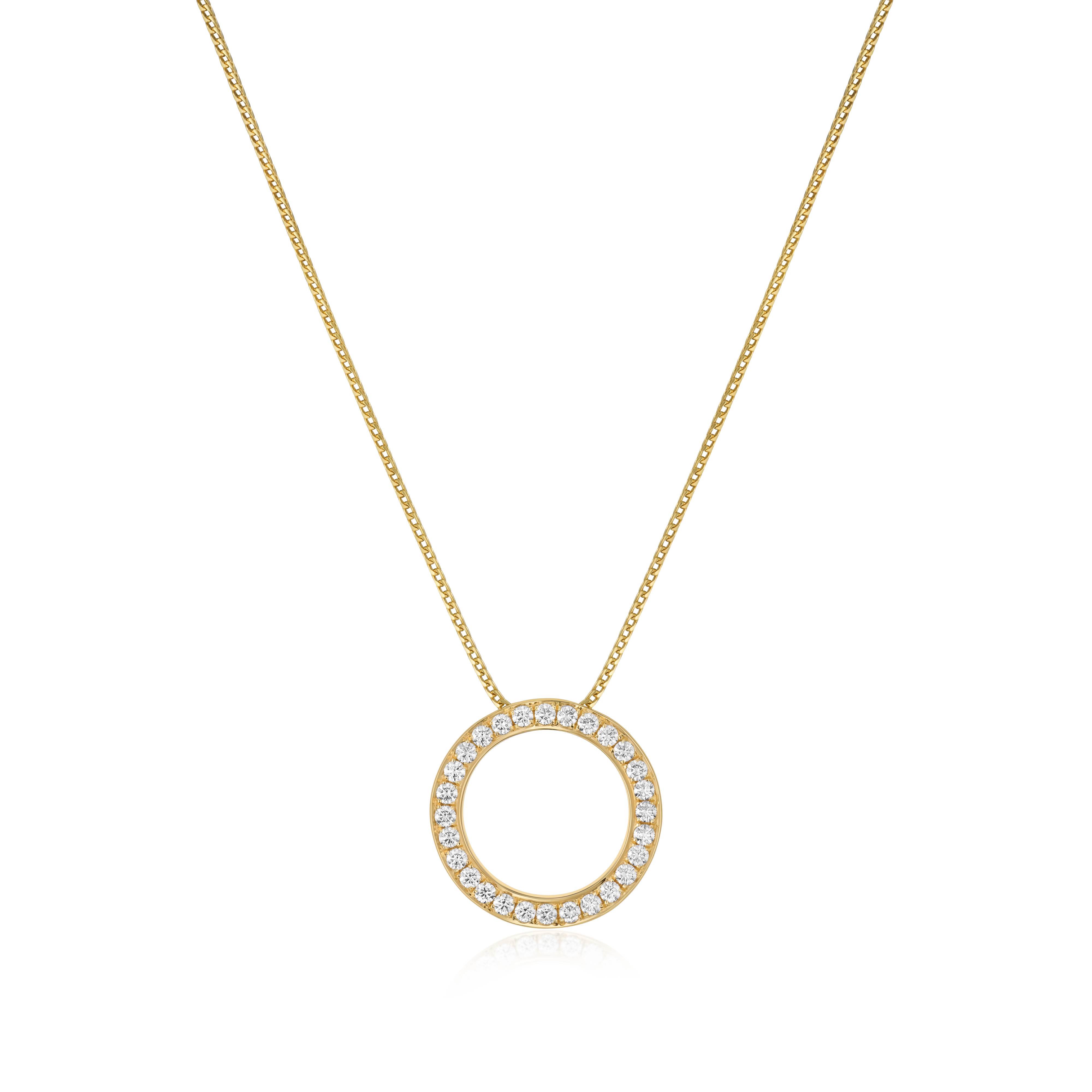 Gold necklace with a circular pendant on a white background