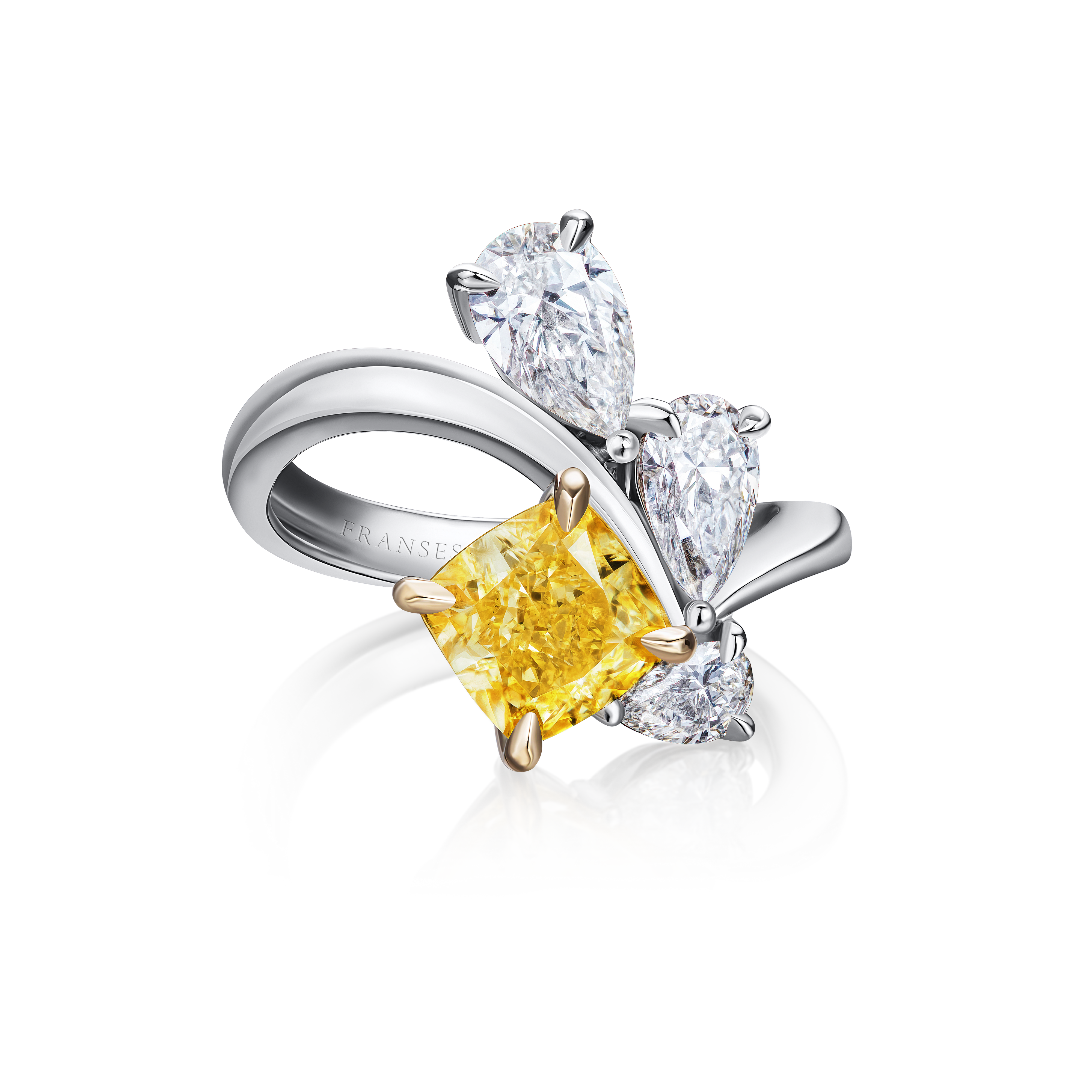 Diamond ring with a yellow center stone on a white background
