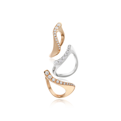 Pair of gold and silver earrings on a white background