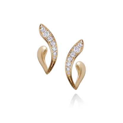 Gold earrings with diamond accents on a white background