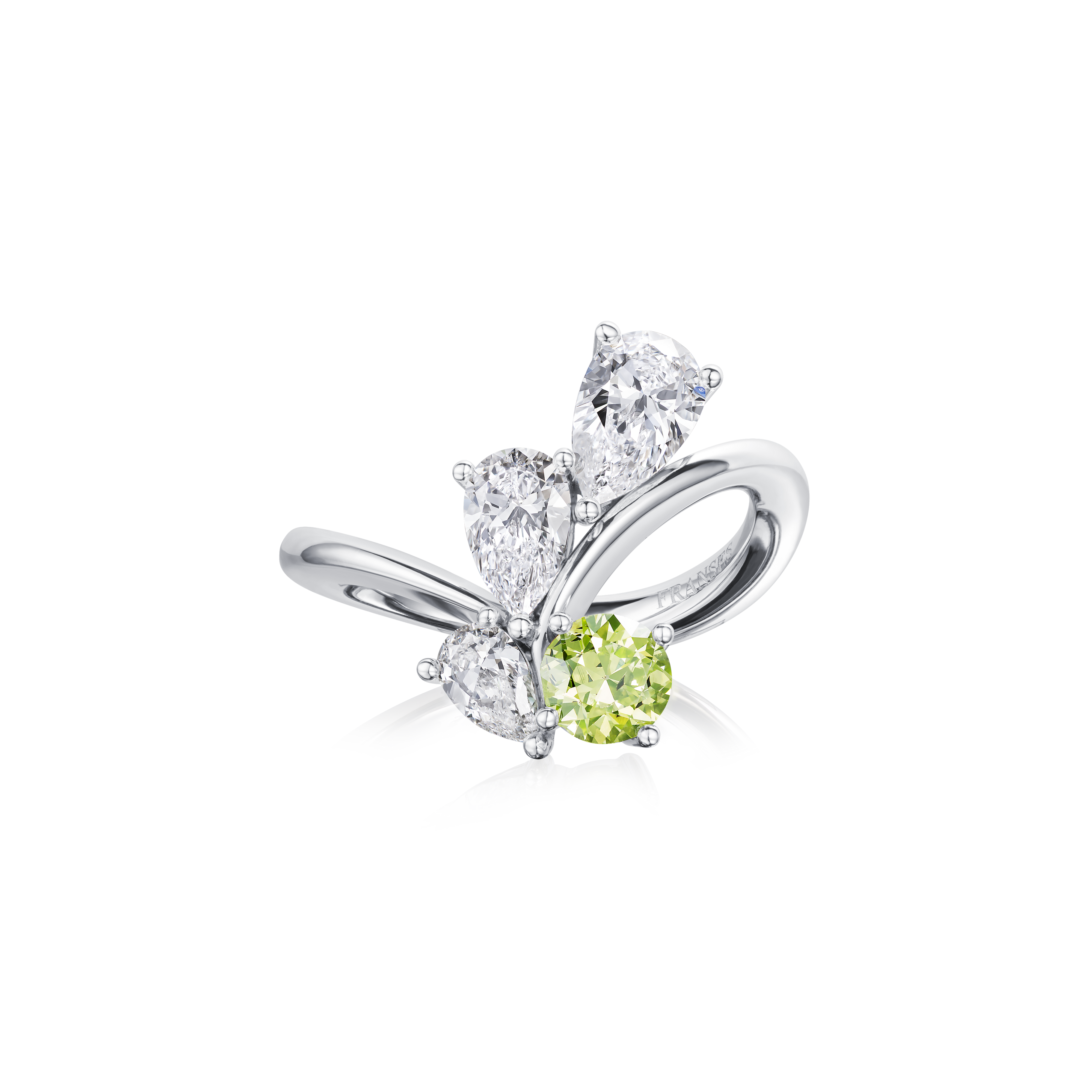 Silver ring with green gemstone on a white background