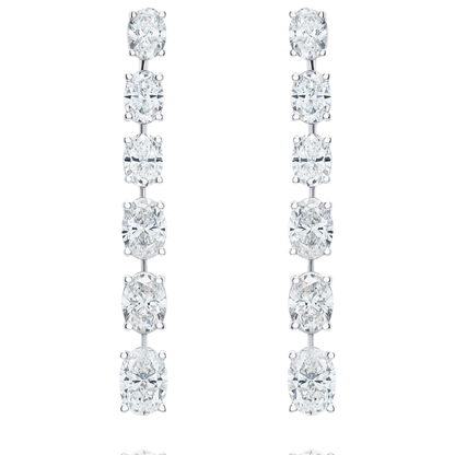 Pair of diamond earrings on a white background