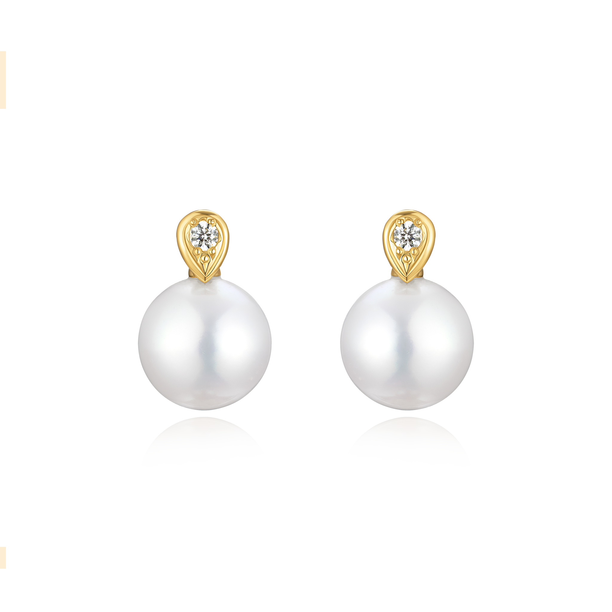 Pearl earrings with gold tops on a white background
