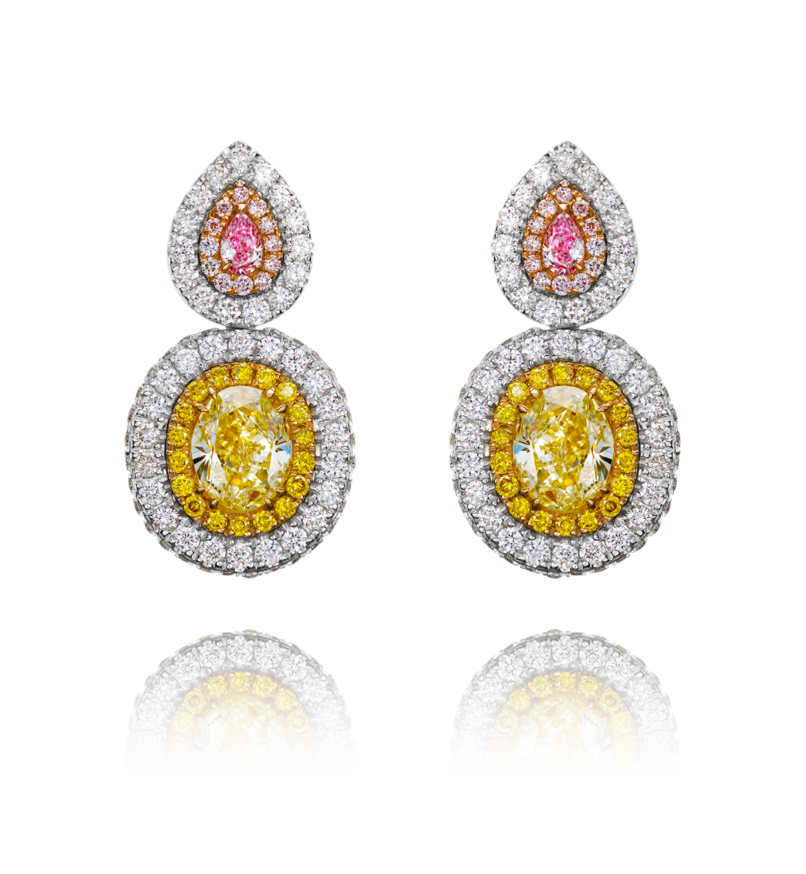 Pair of earrings with yellow and pink gemstones on a white background