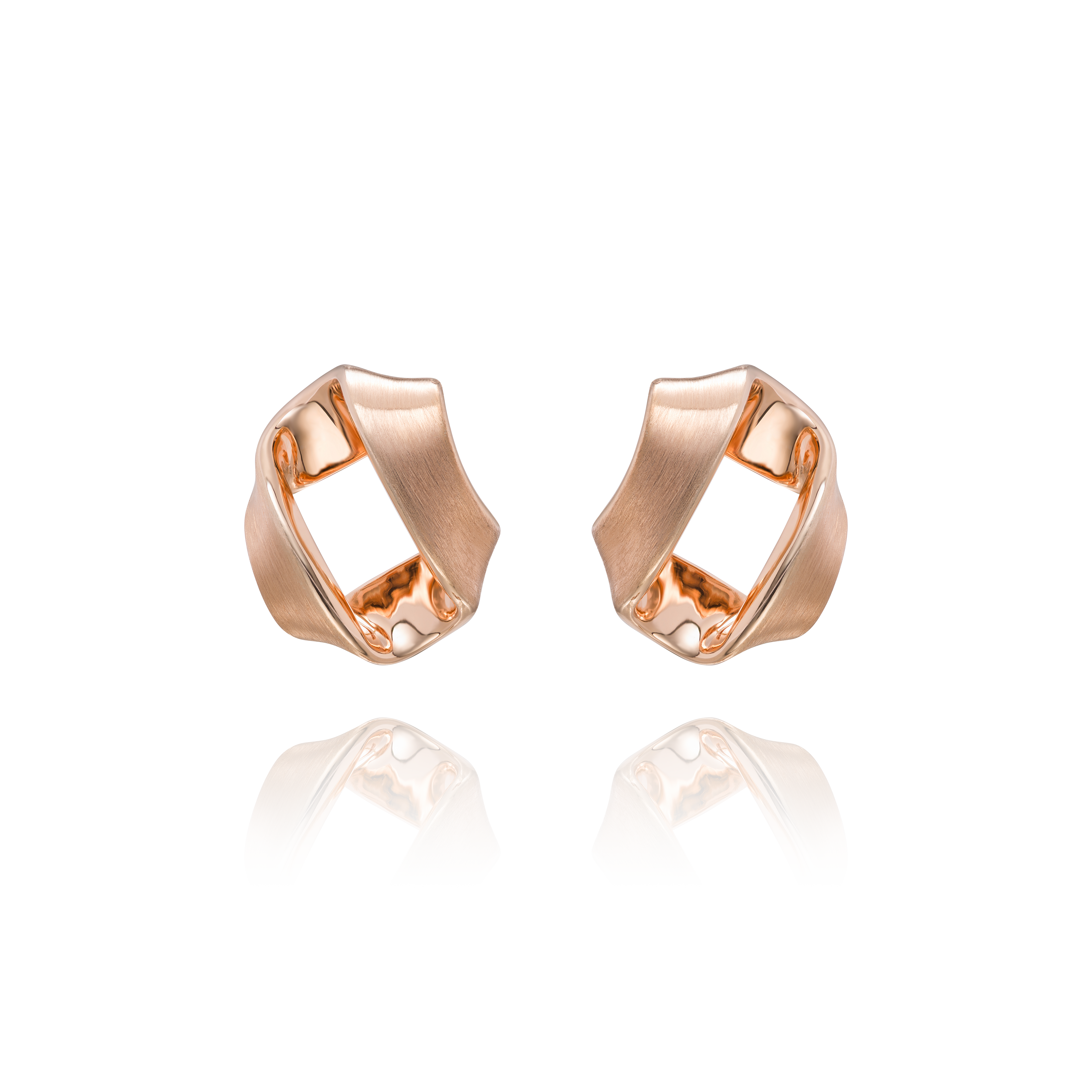 Four rose gold rings with a geometric design on a white background