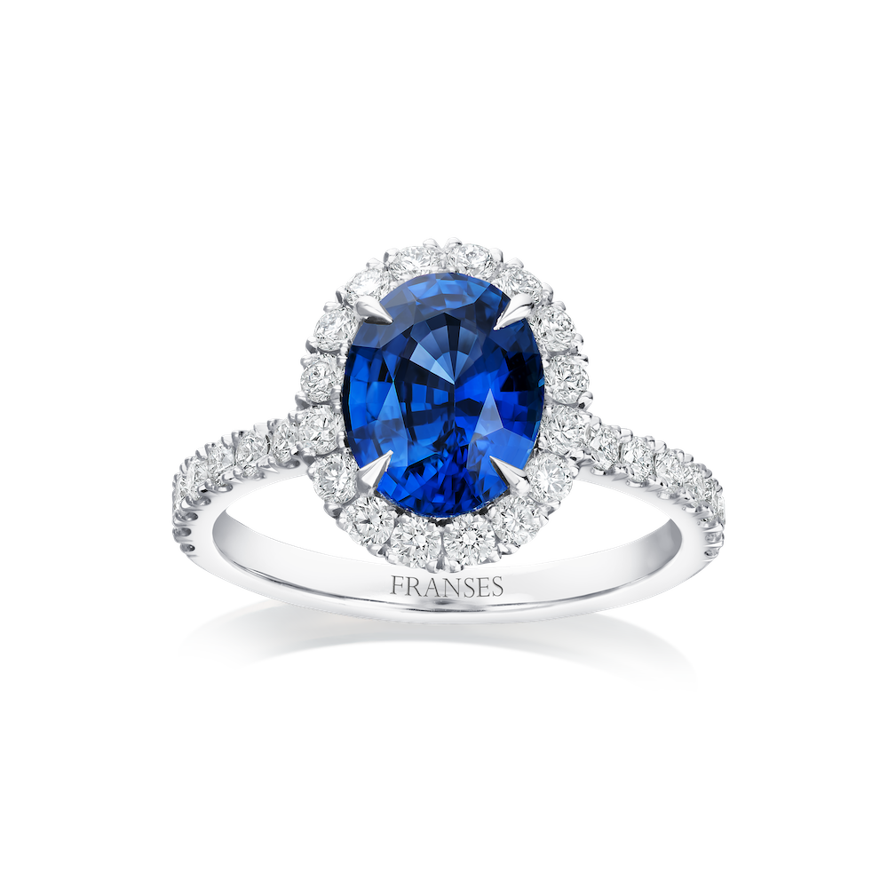 Silver ring with a blue gemstone and diamond accents on a white background, branded 'FRANSES'.
