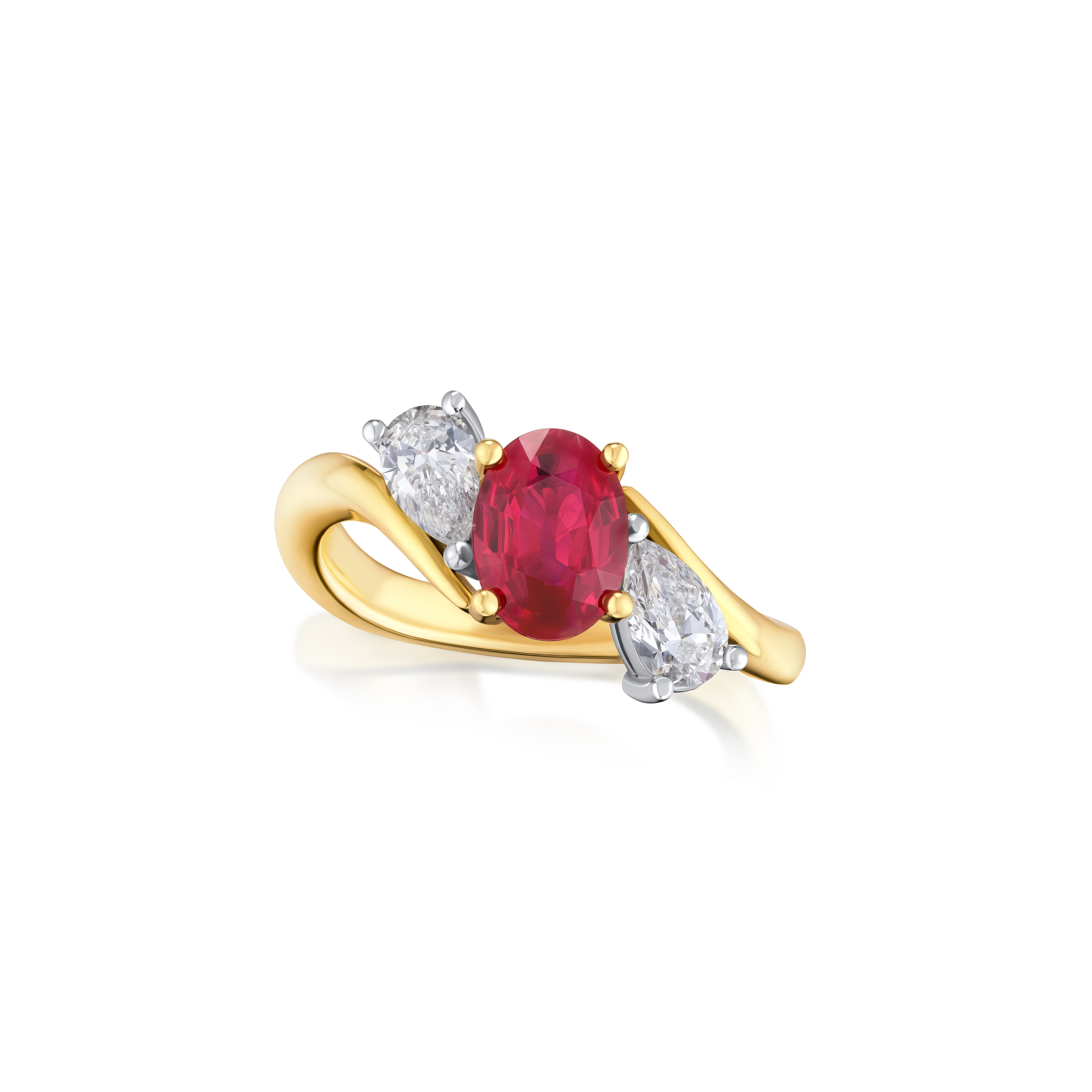 Gold ring with a ruby gemstone and two diamonds on a white background