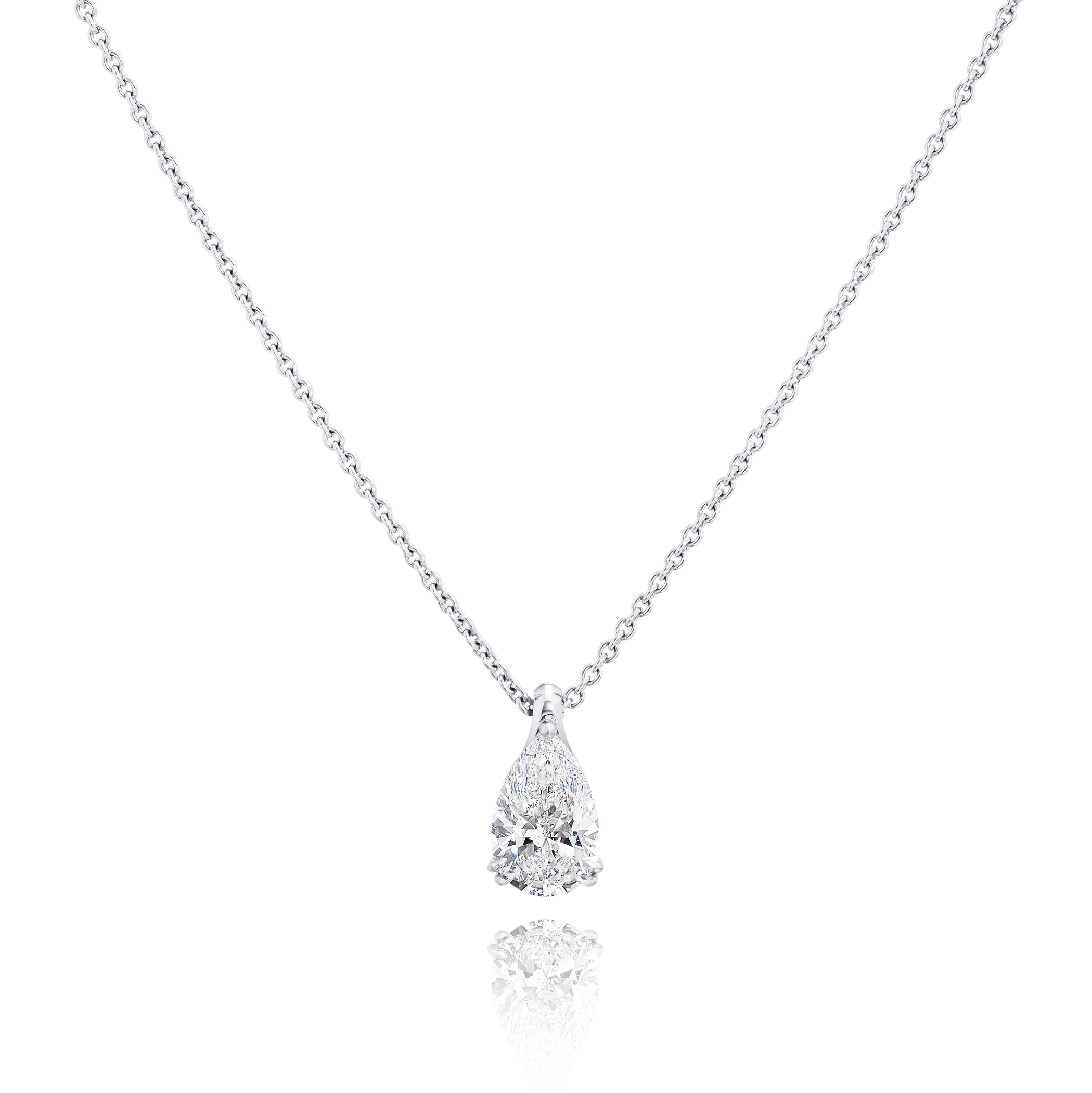 Teardrop-shaped diamond pendant on a chain against a white background