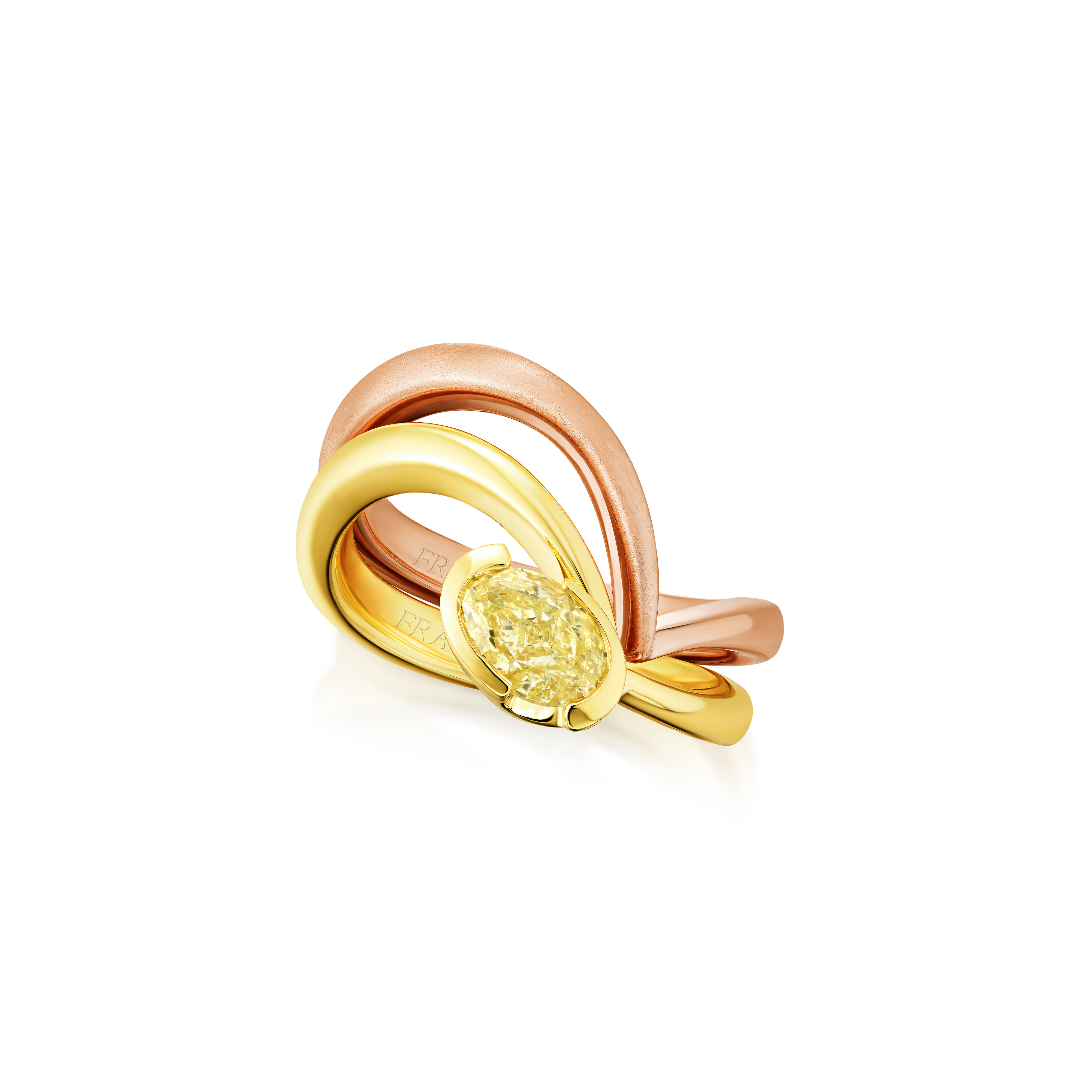 Three gold rings with a central yellow gemstone on a white background