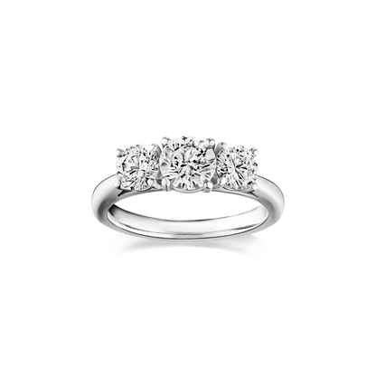 Diamond ring with three stones on a white background