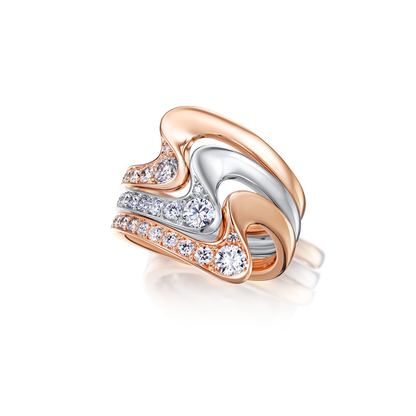 Two-tone heart-shaped ring with diamonds on a white background