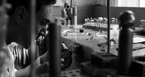 Person working on bespoke jewellery in a workshop